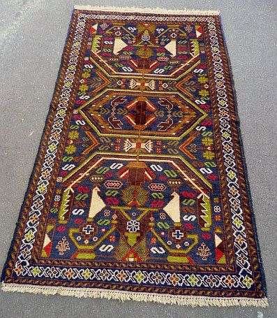 AWESOME BALOOCHI, GENUINE PAKISTAN HANDKNOTTED WOOLEN CARPET. VALUE R 7500.