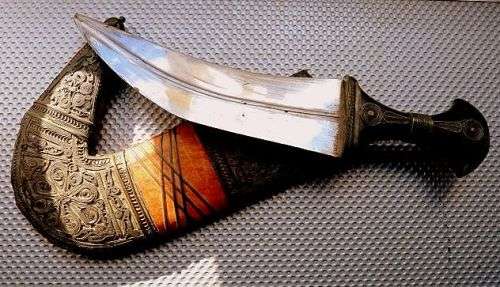 ORIENTAL SWORD IN SCABBORD,HIGHLY DECORATED.  GENUINE LEATHER