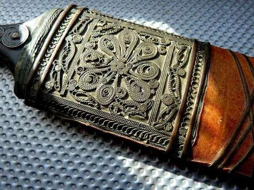 ORIENTAL SWORD IN SCABBORD,HIGHLY DECORATED.  GENUINE LEATHER