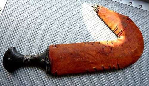 ORIENTAL SWORD IN SCABBORD,HIGHLY DECORATED.  GENUINE LEATHER