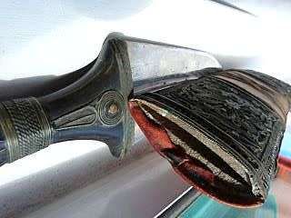 ORIENTAL SWORD IN SCABBORD,HIGHLY DECORATED.  GENUINE LEATHER
