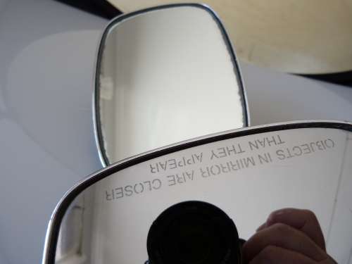 2 VINTAGE MOTORBIKE MIRRORS, ONE IS A HARLEY DAVIDSON.