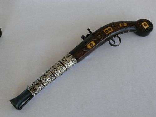 OLD REPLICA OF A PERCUSSION PISTOL WITH BONE AND BRASS INLAYS