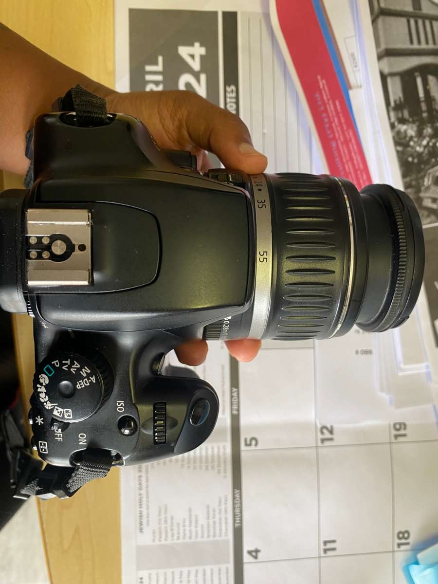 Canon 1000D camera with lens,battery,and charger