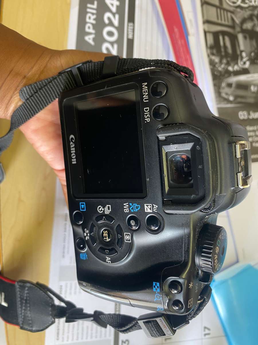 Canon 1000D camera with lens,battery,and charger