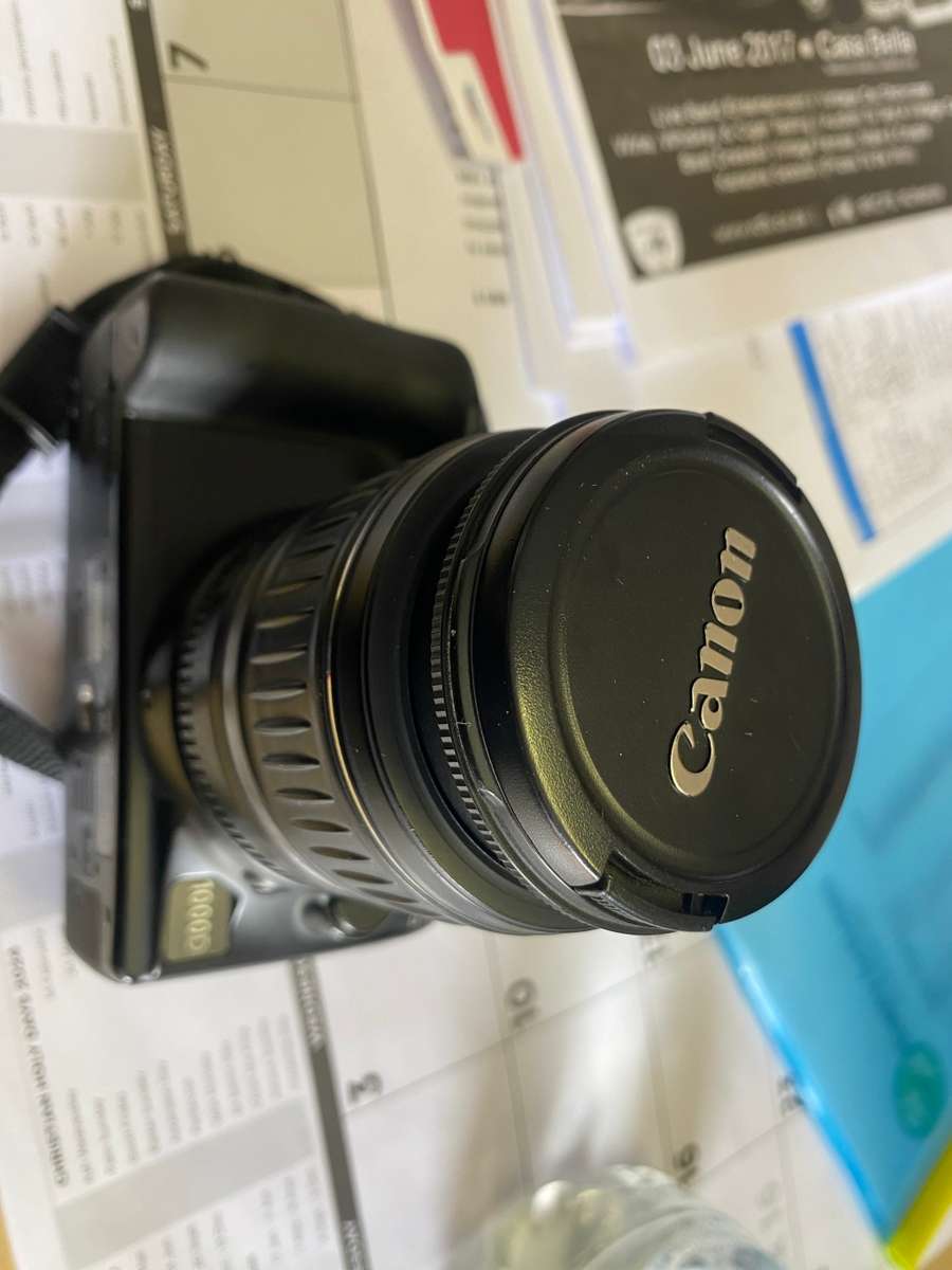 Canon 1000D camera with lens,battery,and charger