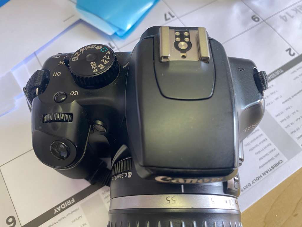 Canon 1000D camera with lens,battery,and charger
