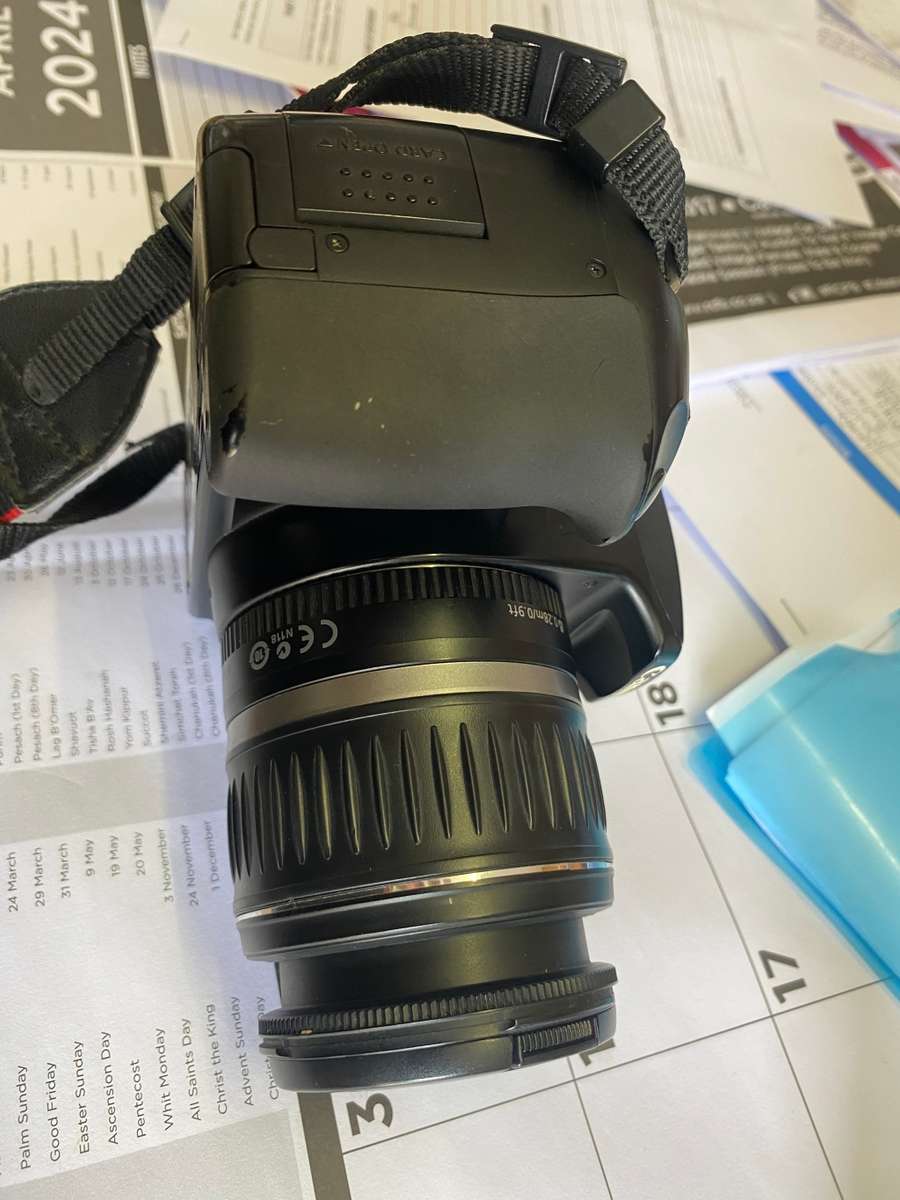 Canon 1000D camera with lens,battery,and charger