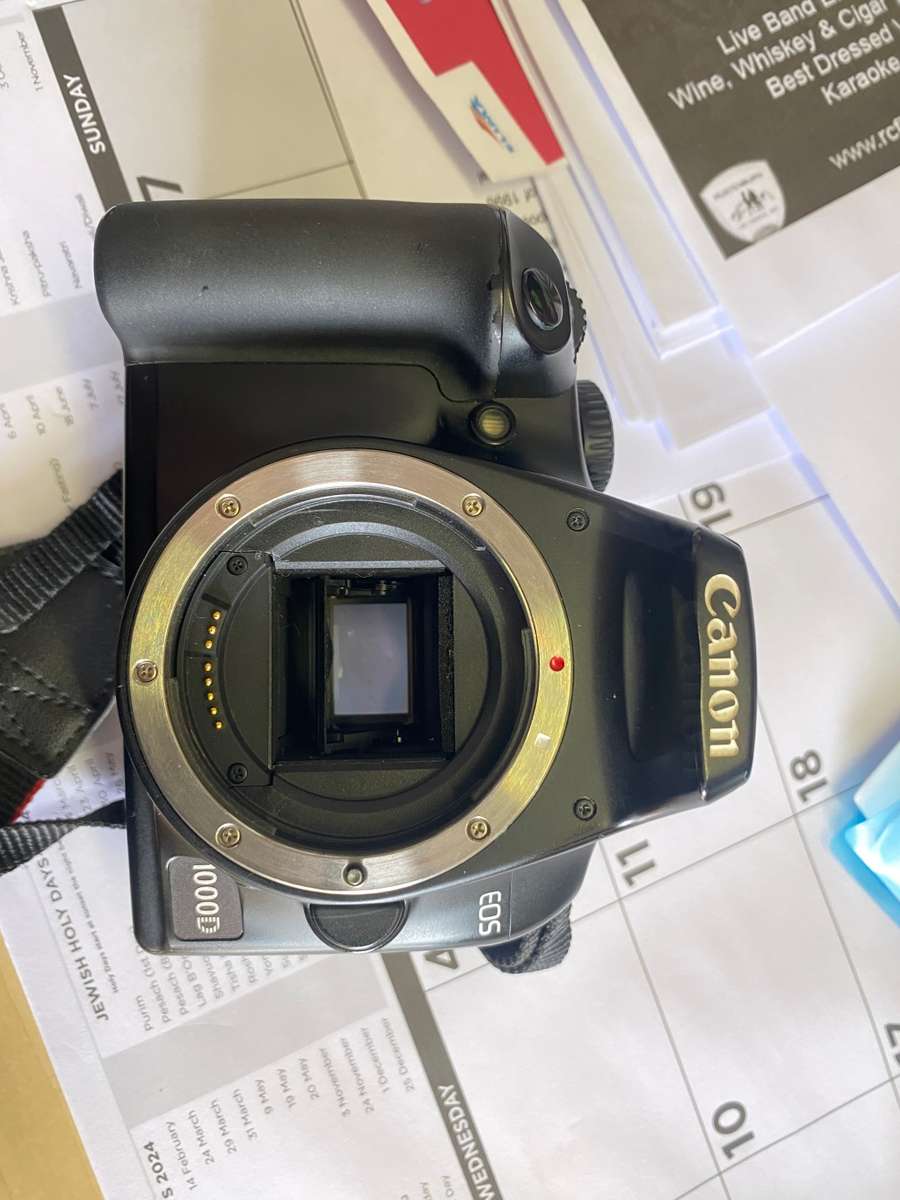 Canon 1000D camera with lens,battery,and charger