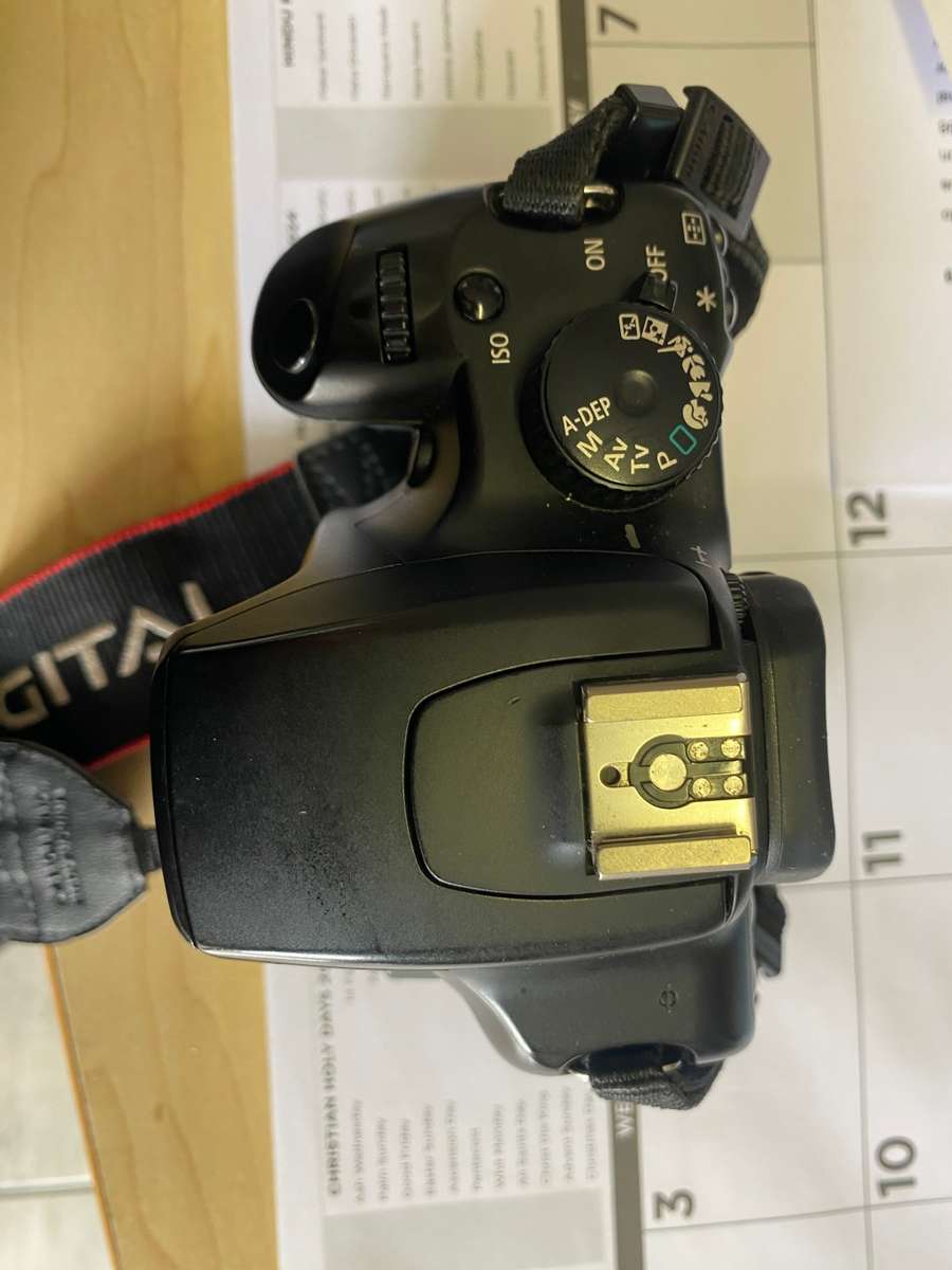 Canon 1000D camera with lens,battery,and charger