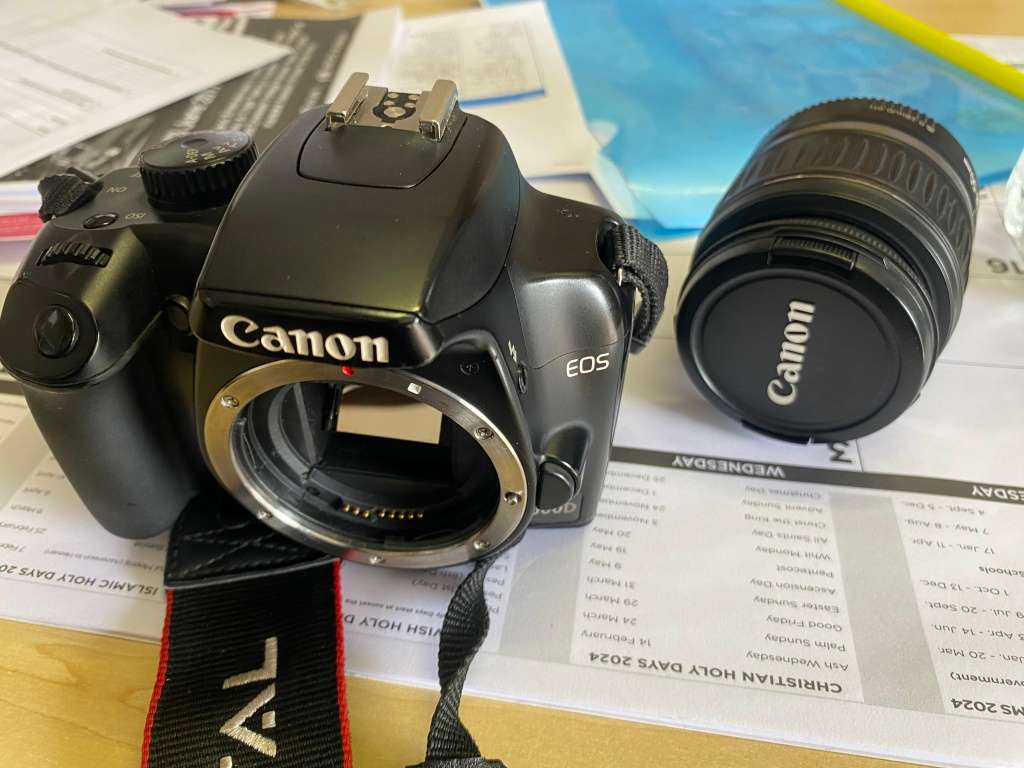 Canon 1000D camera with lens,battery,and charger