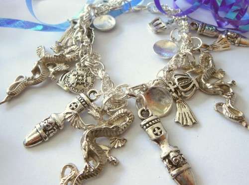 Silvertone Charm Bracelet with Dragon and Crown Charms