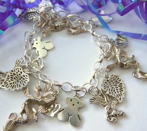Silvertone Charm Bracelet with Dragon and Leaf Charms