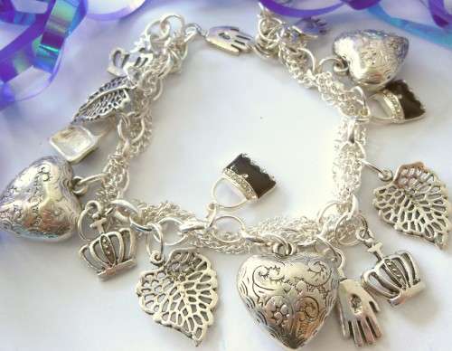Silvertone Charm Bracelet with Crown, Hand, Heart and Handbag type Charms