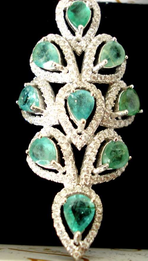 EXQUISITE  .925  STERLING SILVER RING WITH NATURAL EMERALDS