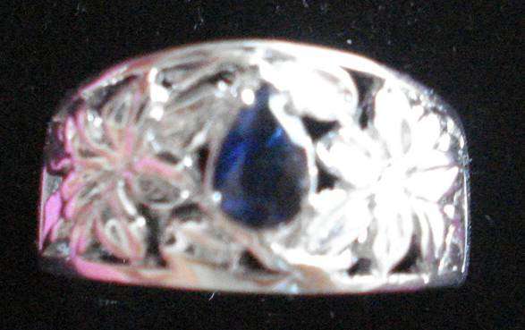 9k White gold plated sapphire ring.  0.450cts