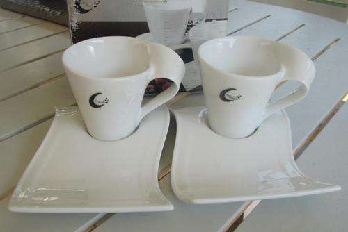 4 Piece "Wave" Porcelain Cup and Saucer Set