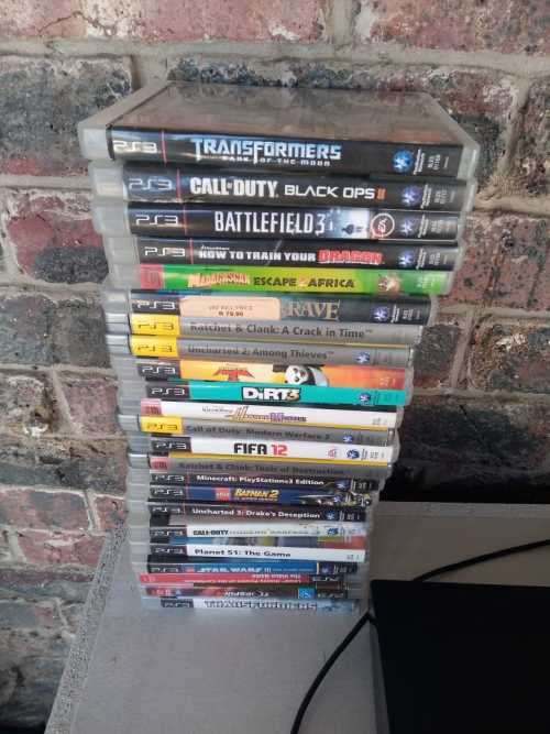PLAYSTATION 3 WITH 23 GAMES AND 1 CONTROLLER