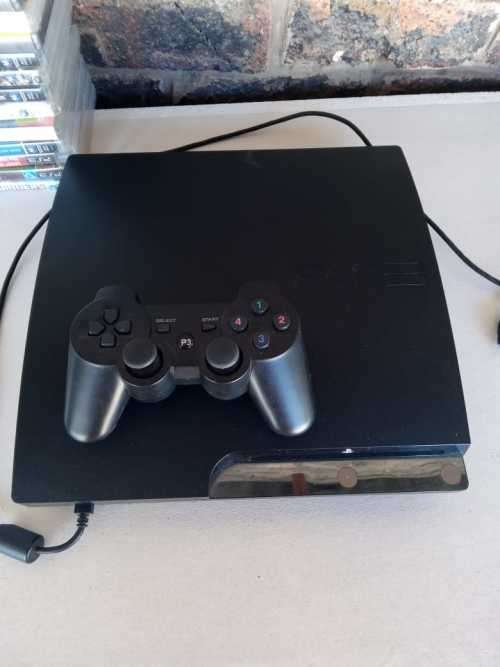 PLAYSTATION 3 WITH 23 GAMES AND 1 CONTROLLER