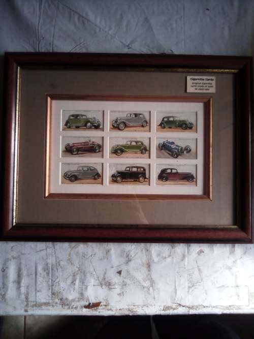 Cigarette cards neatly mounted in smart wooden frames