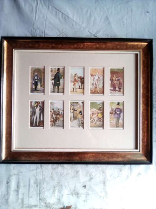 Cigarette cards neatly mounted in smart wooden frames