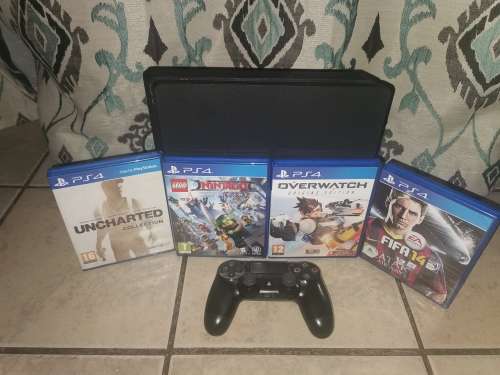 Playstation 4 Slim Line 1 Terabyte and Games