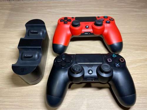 Playstation 4 , 2 Controllers , 4 Games and Charging dock Bundle