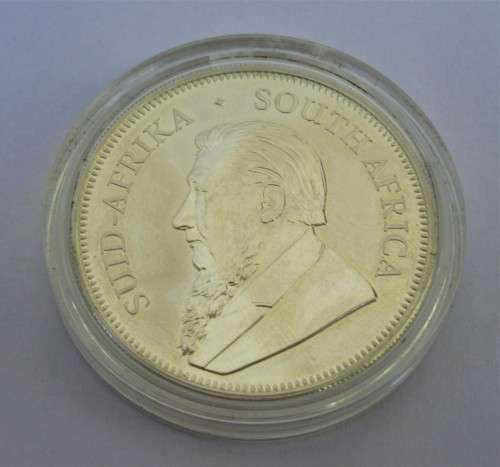INVESTMENT~ONE OUNCE U/C 2017 FINE 999 SILVER KRUGER RAND COIN IN PLASTIC CAPSULE.
