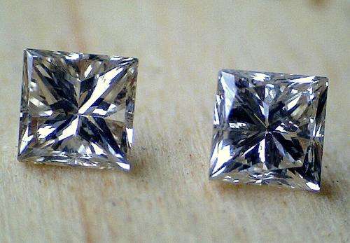 Gorgeous 0.66 engagement quality princess pair - VS2 - light champagne