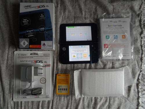 Nintendo 3DS new XL + sealed charger + 1 game