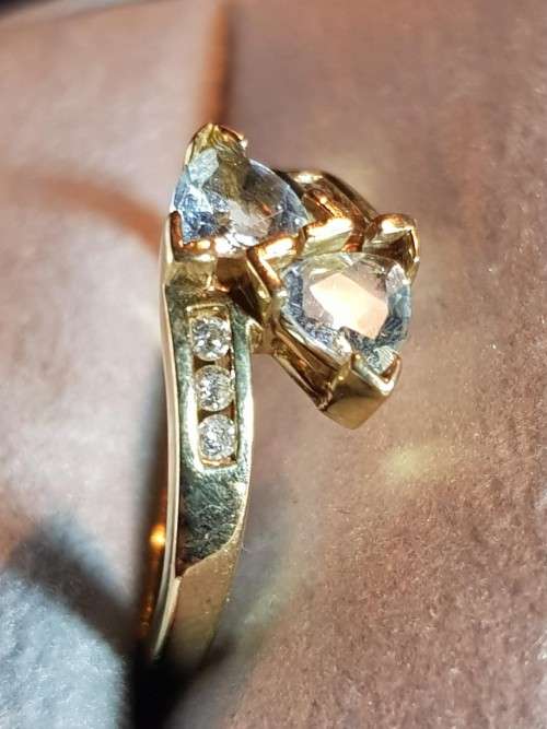 10kt Gold Aquamarine ring with 3 diamonds flanking each side