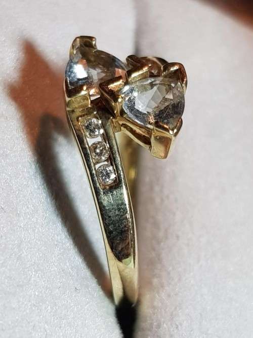 10kt Gold Aquamarine ring with 3 diamonds flanking each side