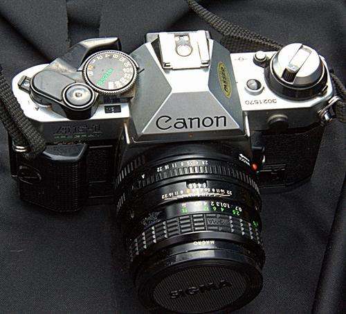 CANON AE-1 35mm CAMERA WITH 28mm  SIGMA LENS