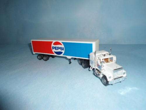 A Herpa HO GMC T/T with trailer