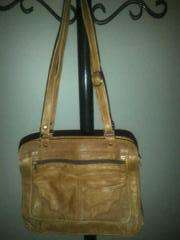 Tan handbag smells like leather