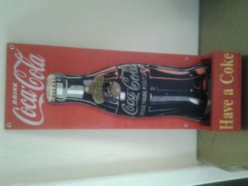 coca cola wall mounted sign and opener