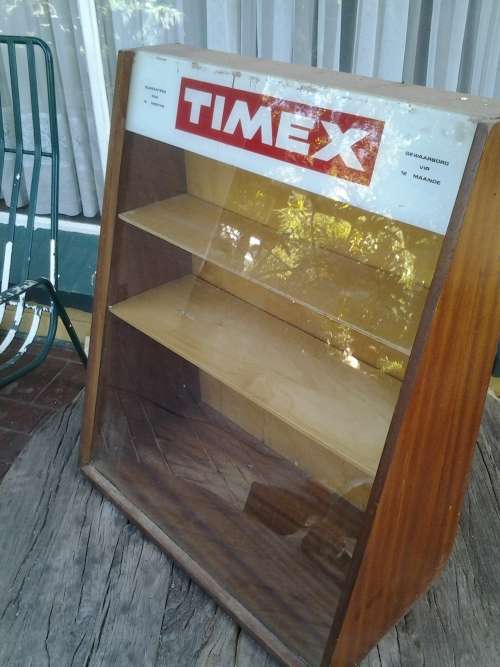 antique advertising timex display cabinet