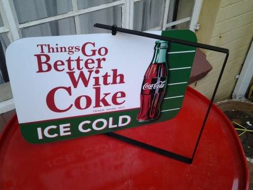 coca cola twirl sign