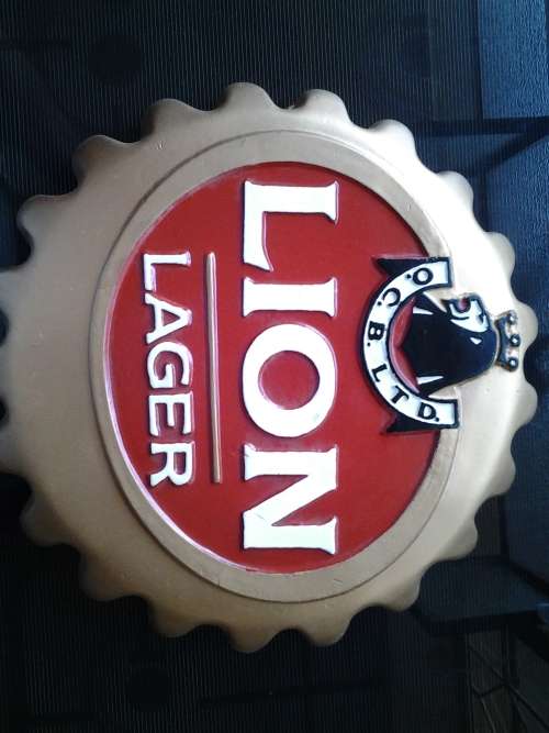 lion lager bottle cap sign