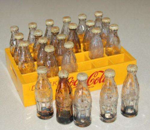 24 Miniature Coca Cola bottles in a plastic crate - Bottle height 65mm - Crate 150mm X 100mm