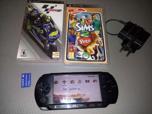 Psp street ( has big scratch on the front plate) with 2 games and memory card.