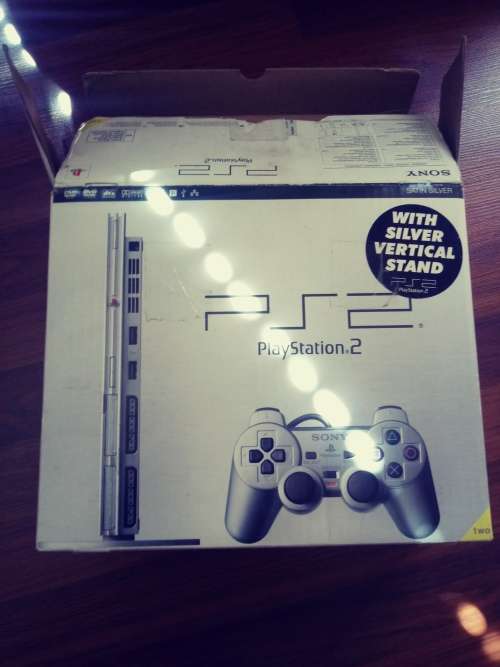 Playstation 2 console with box in fair condition ( please see pics) works 100%