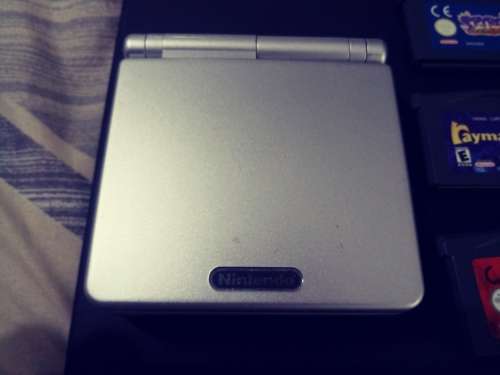 Game Boy Advance SP with 6 Games and Charger ( Good Condition)