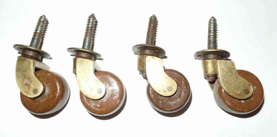 ANTIQUE BRASS & PORCELAIN TABLE CASTORS