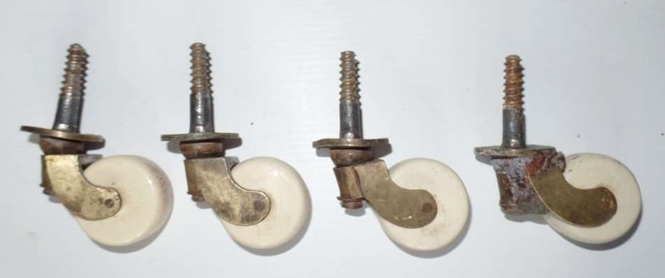 ANTIQUE LARGE VICTORIAN BRASS AND CERAMIC CASTORS X 4 - FOR DINING TABLE