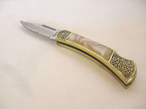 Vintage folding pocket knife, ornate handle, mother of pearl