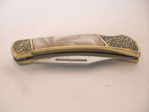 Vintage folding pocket knife, ornate handle, mother of pearl