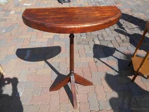 A VINTAGE HALF MOON TABLE ON CENTRAL COLUMN
