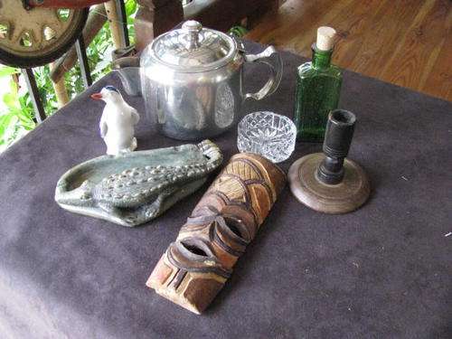 A JOBLOT OF 7 ASSORTED ITEMS...A TEAPOT.PENGUIN, MASK, CANDLESTICK ETC..... BID IS FOR THE LOT