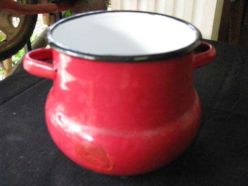 A VINTAGE RED ENAMEL SUGAR BOWL
